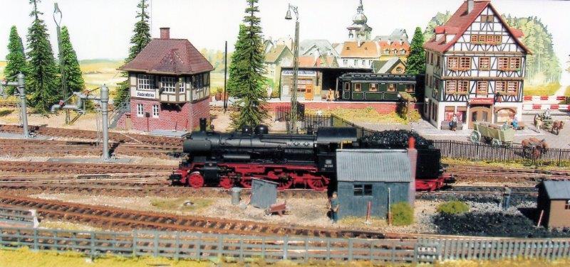 The BR38 moves off to it's next duty. Note the passenger train at the halt beyond.