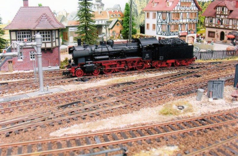 The BR38 runs slowly past the signal box.