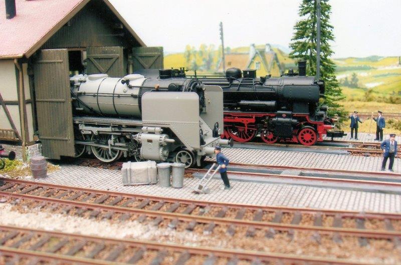 BR62 4-6-4T in photographic grey and BR38 4-6-0 emerge from the two road engine shed at Rodenheim.